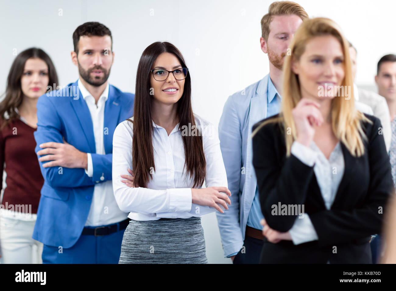 Group picture of business team posing in office Stock Photo - Alamy