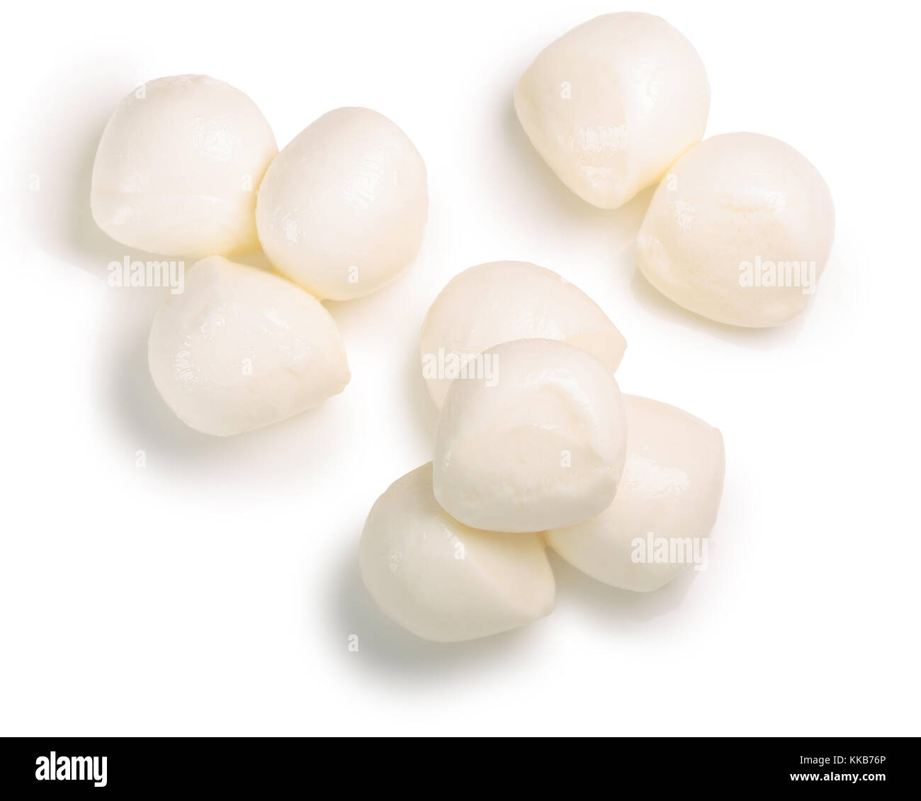Mozzarella cheese balls, Ciliegini (small, cherry-like), top view, piles. Clipping paths, shadows separated Stock Photo