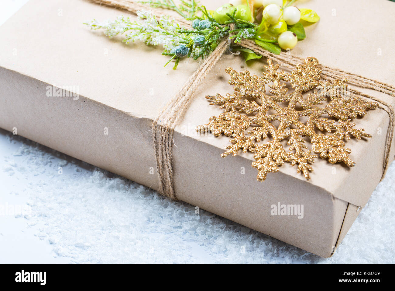 Christmas background with gift, Christmas tree branches and snow. Free space Stock Photo