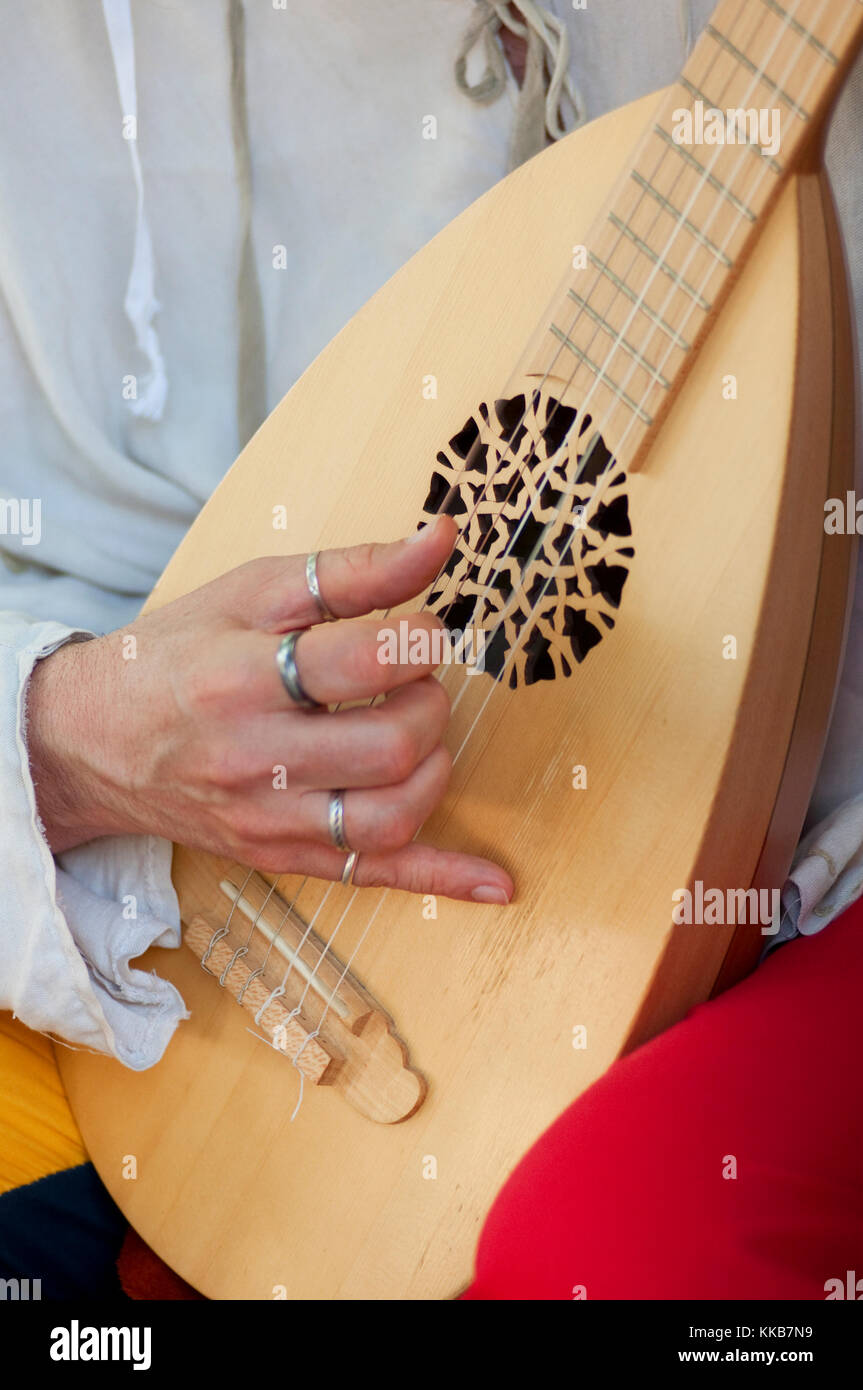 Italy, Lombardy, Crema, Mediaeval Festival, Men Dressed in Medieval Costume Playing Musical Instrument Lute Stock Photo