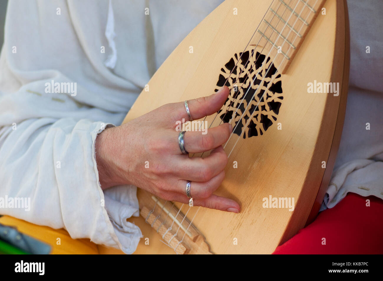 Italy, Lombardy, Crema, Mediaeval Festival, Men Dressed in Medieval Costume Playing Musical Instrument Lute Stock Photo