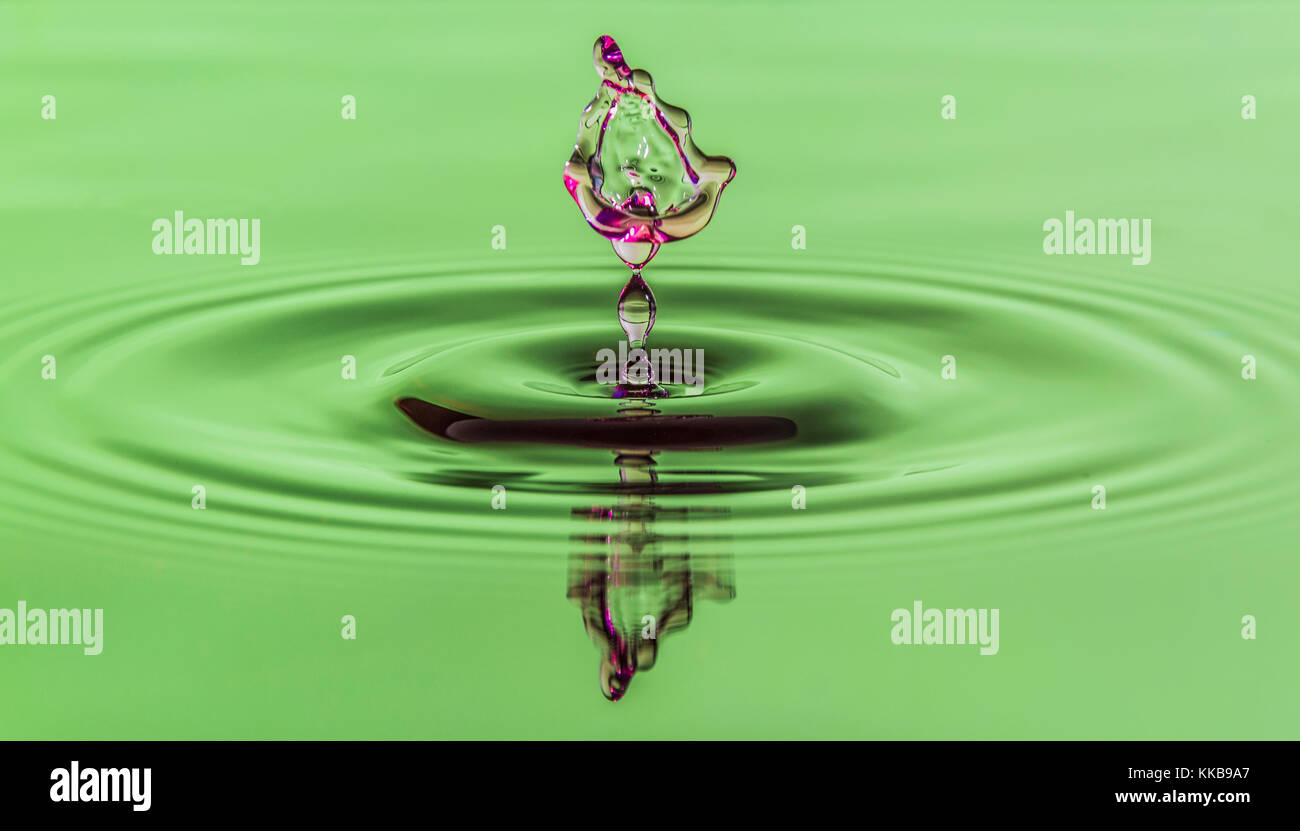 Two water drops colliding Stock Photo - Alamy