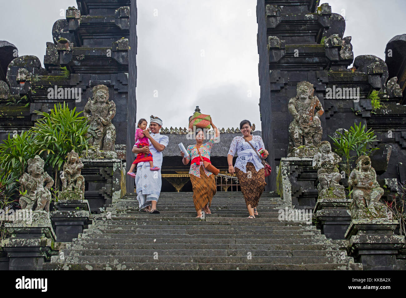 Indonesian tourists visiting Pura Besakih, largest and holiest temple of Hindu religion in Bali on the slopes of Mount Agung in Bali, Indonesia Stock Photo
