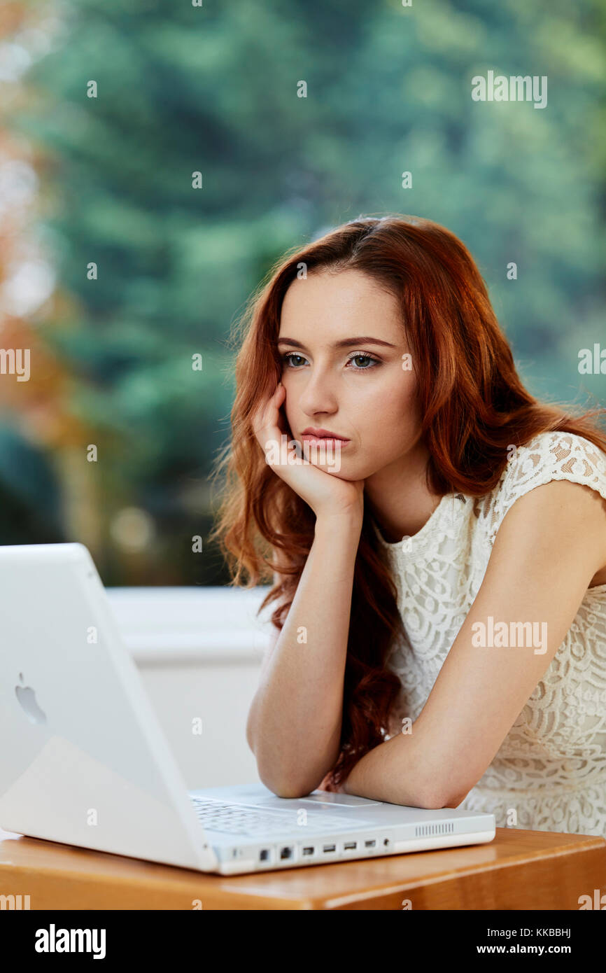 Girl bored at work Stock Photo Alamy