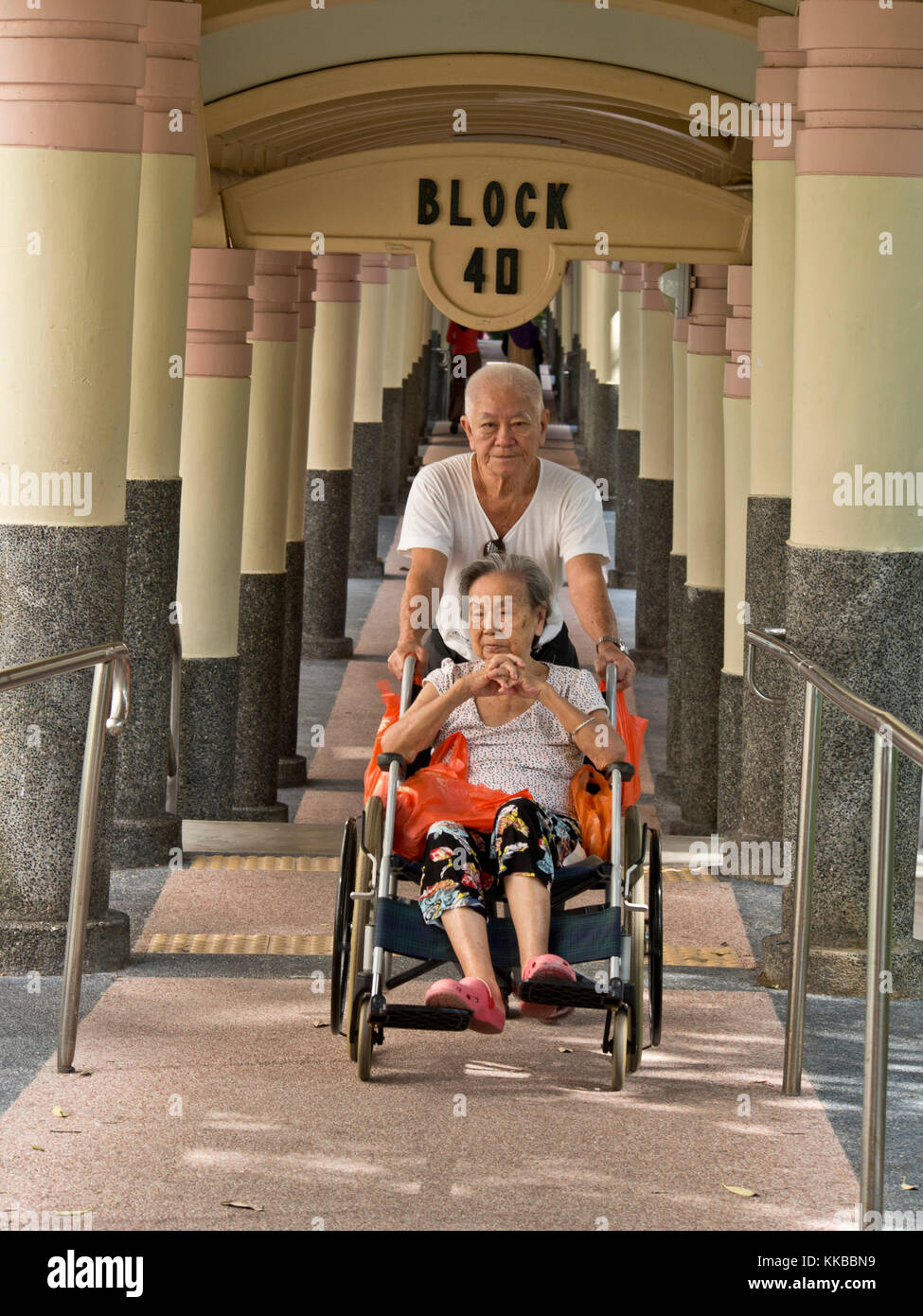Senior citizens in a wheelchair Singapore Stock Photo Alamy