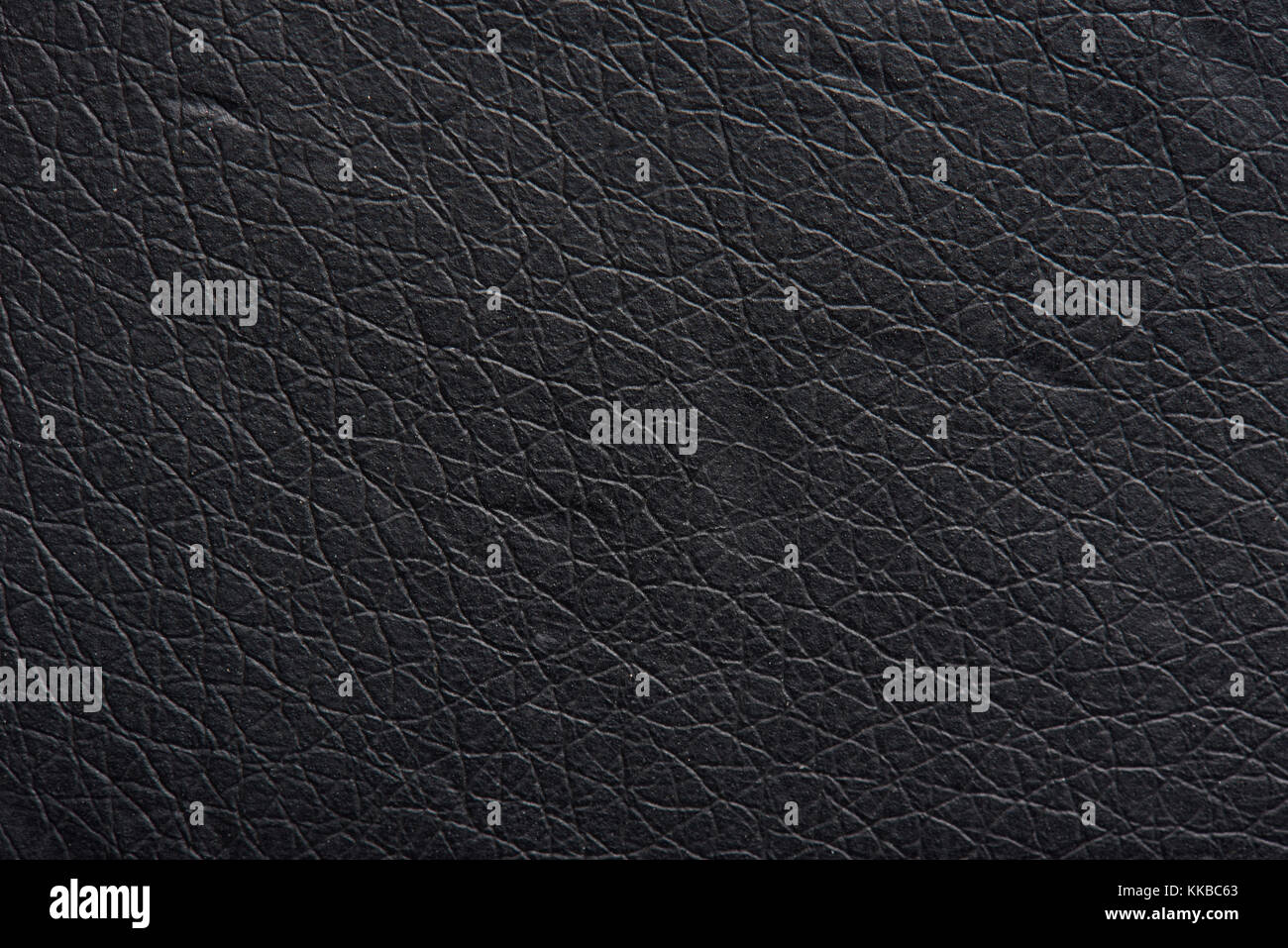 Black leather texture material close-up. Cow skin dark pattern Stock Photo