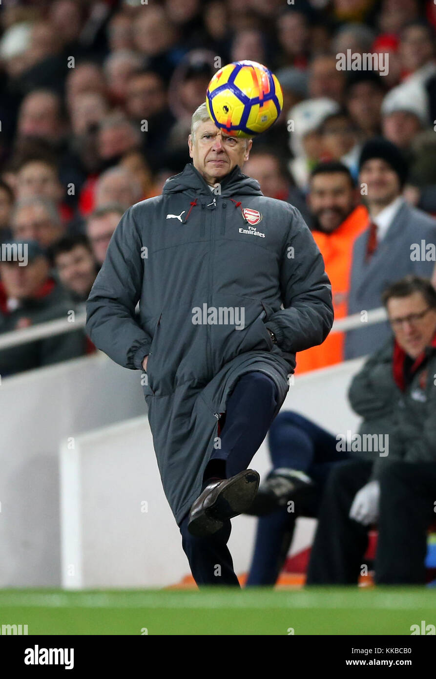 Arsenal manager Arsene Wenger kicks the ball back in play during the ...