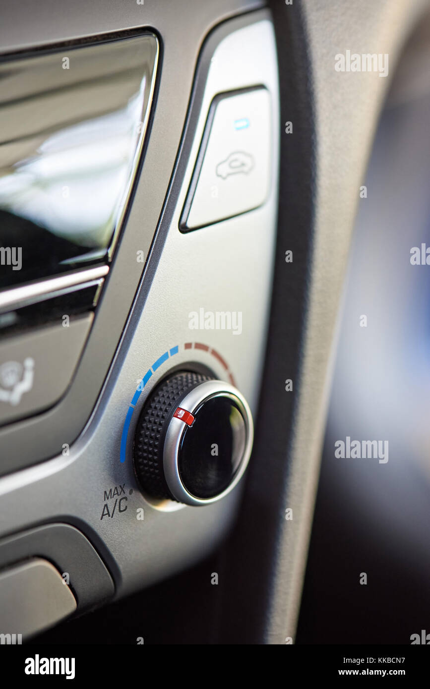 Air conditioner knob close-up in modern car. Control button of car climate temperature Stock Photo