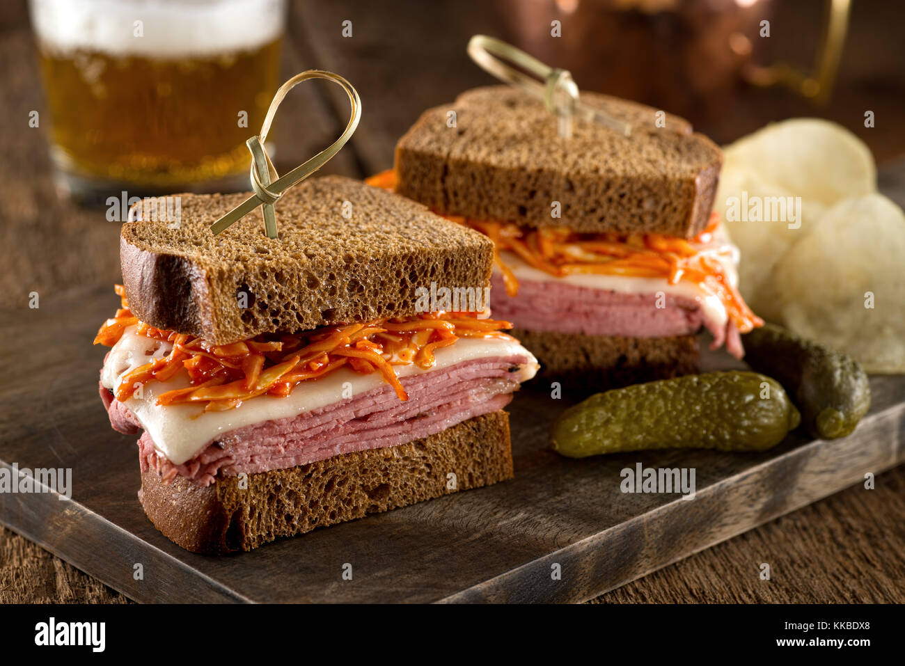Smoked meat on rye sandwich with melted swiss cheese and coleslaw