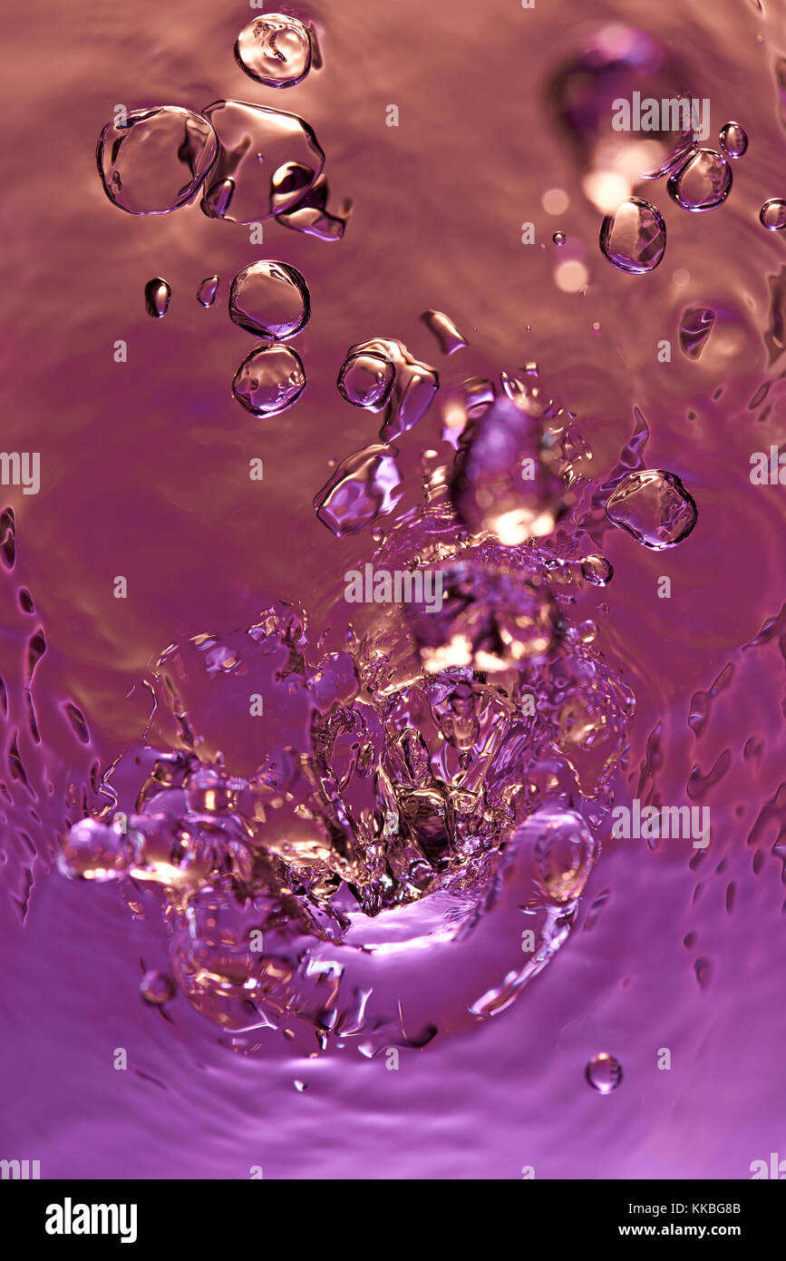 Water colorful abstract red splash above view. Clear abstract purple water splash Stock Photo