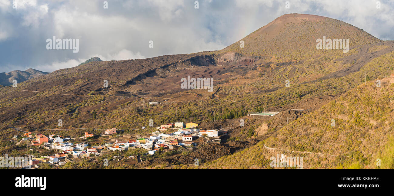 View over the village of Las Manchas towards the heavily quarried volcanic cone of Montana Bilma and the 1909 lava flow from Chinyero at the top right Stock Photo