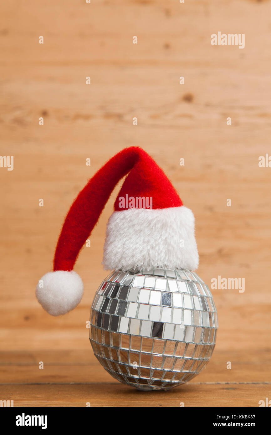 Christmas party background. Santa hat with disco mirrorball Stock Photo