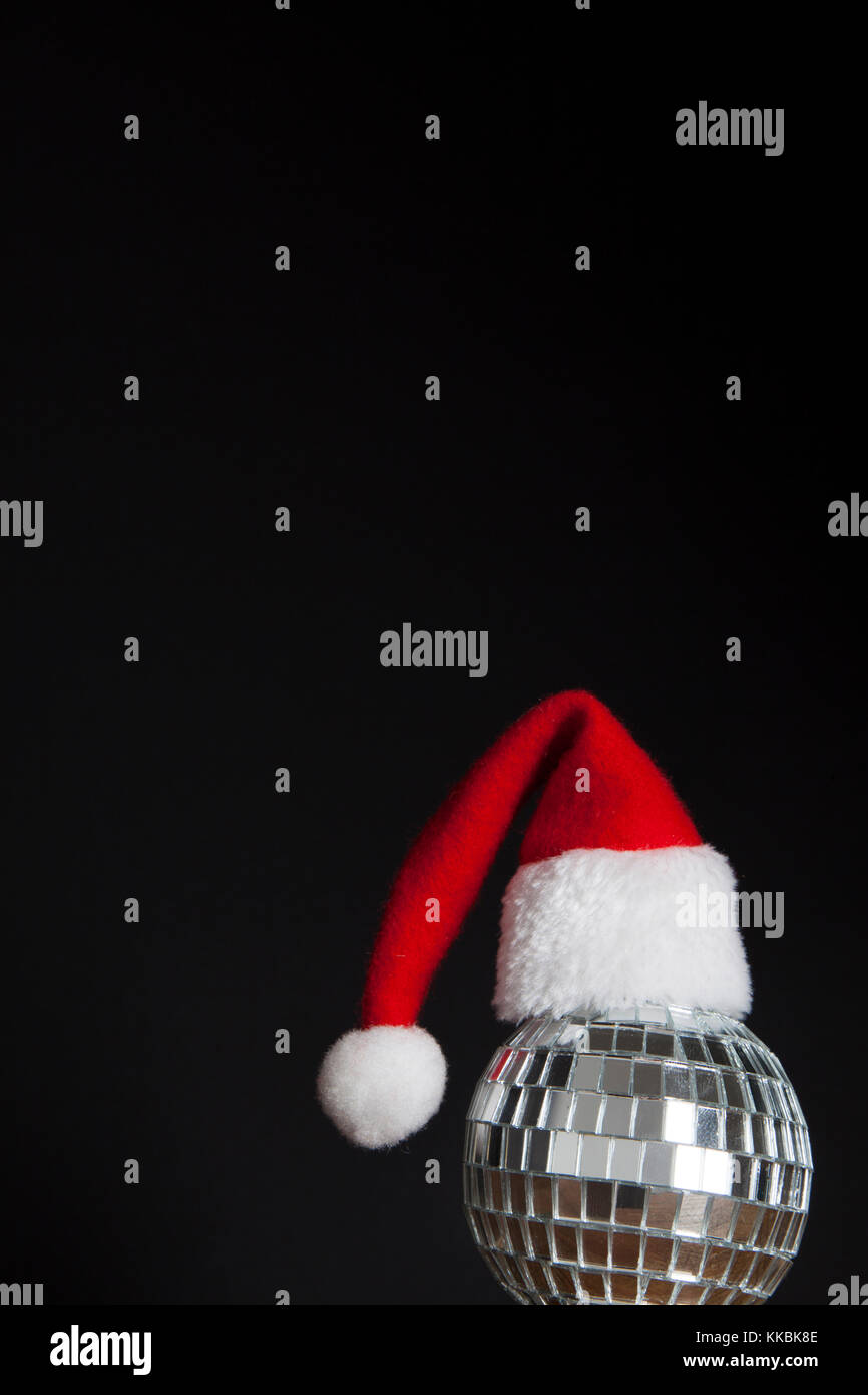 Christmas party background. Santa hat with disco mirrorball Stock Photo