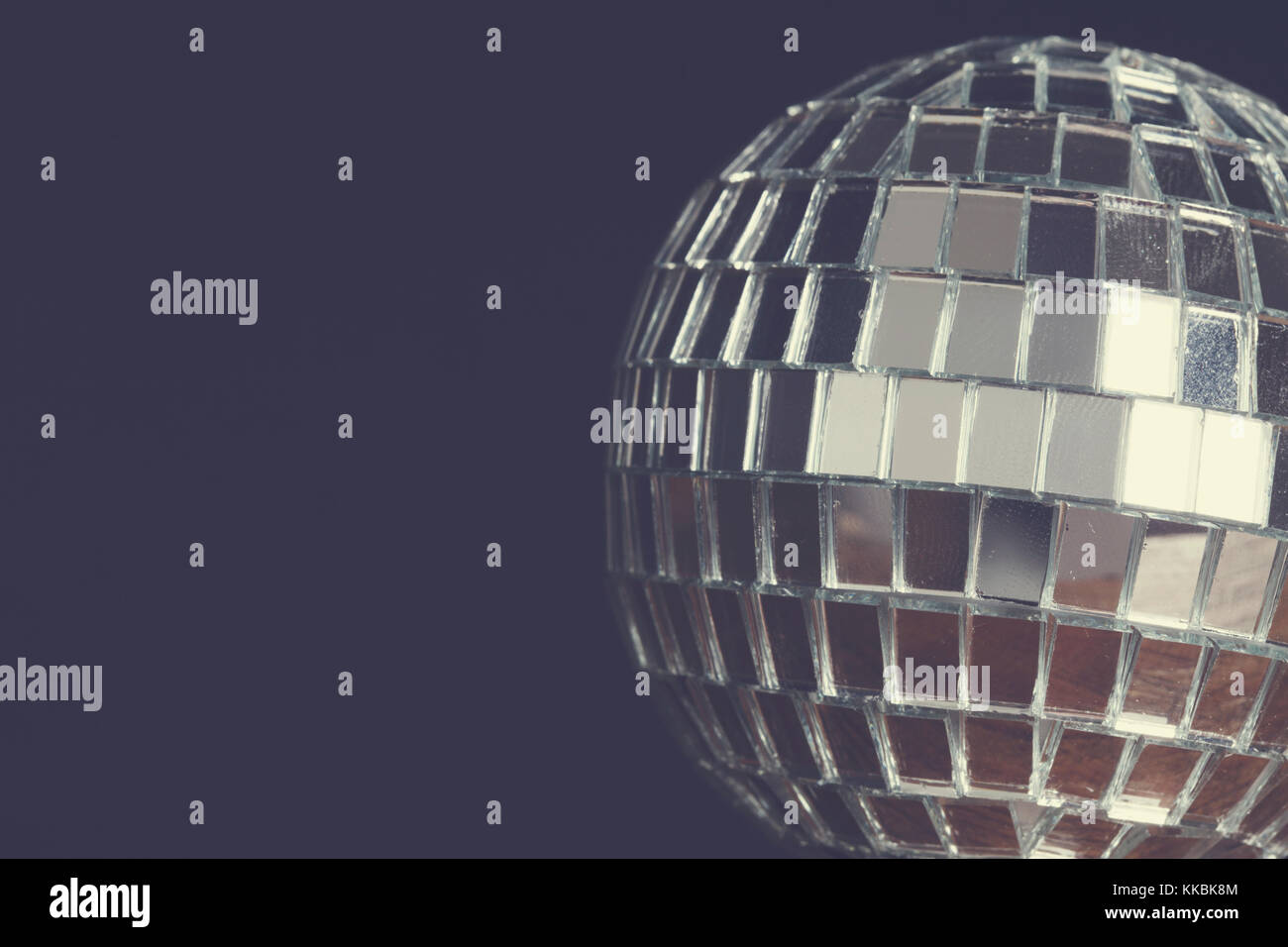 Party background. Disco mirrorball against a black background Stock