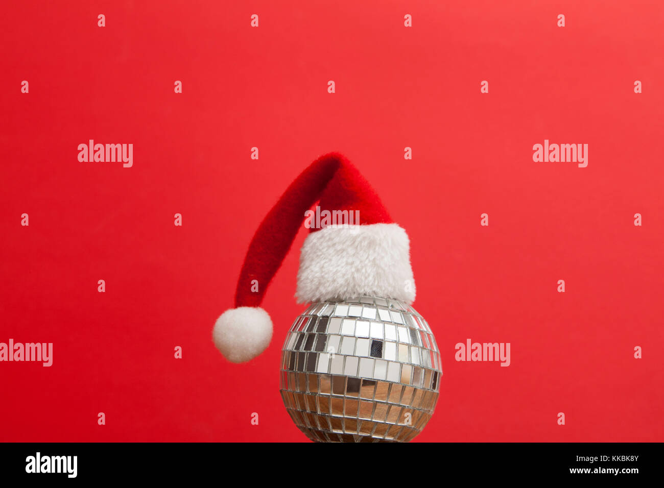 Christmas party background. Santa hat with disco mirrorball Stock Photo