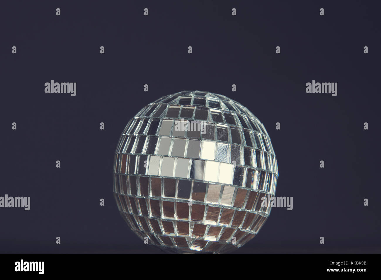 Party background. Disco mirrorball against a black background Stock