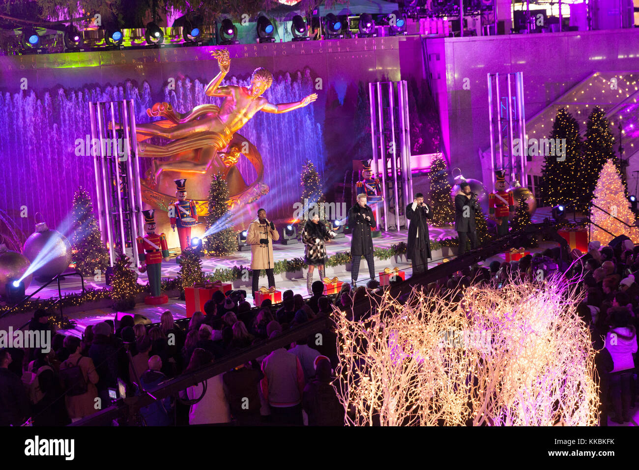 New York, NY - November 29, 2017: Singers Matt Sallee, Kirstin Moldanado, Scott Hoying, Mitch Grassi, Kevin Olusola of the acappella group Pentatonix performs during the 85th Rockefeller Center Christmas Tree Lighting at Rockefeller Center hosted by NBC Stock Photo