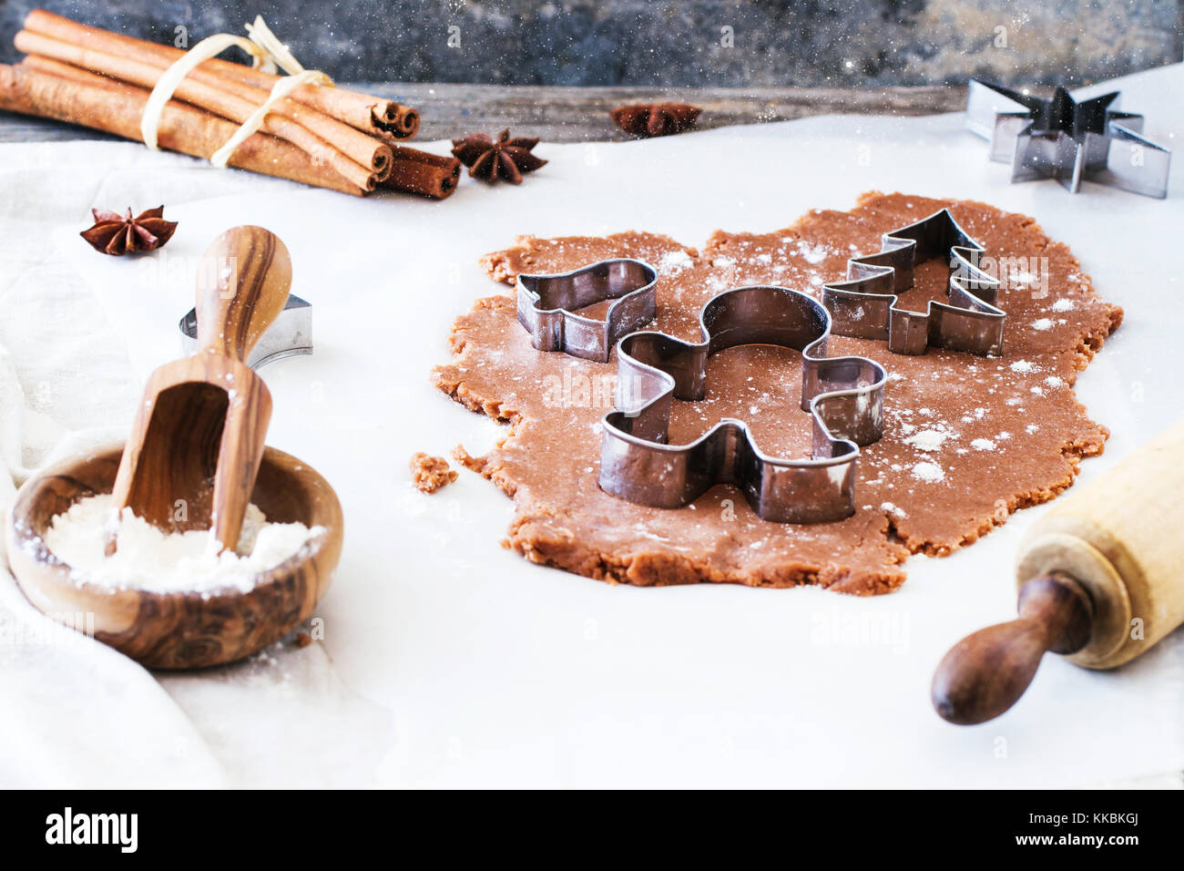 Making christmas cookies with cookie cutters and vintage rollingpin