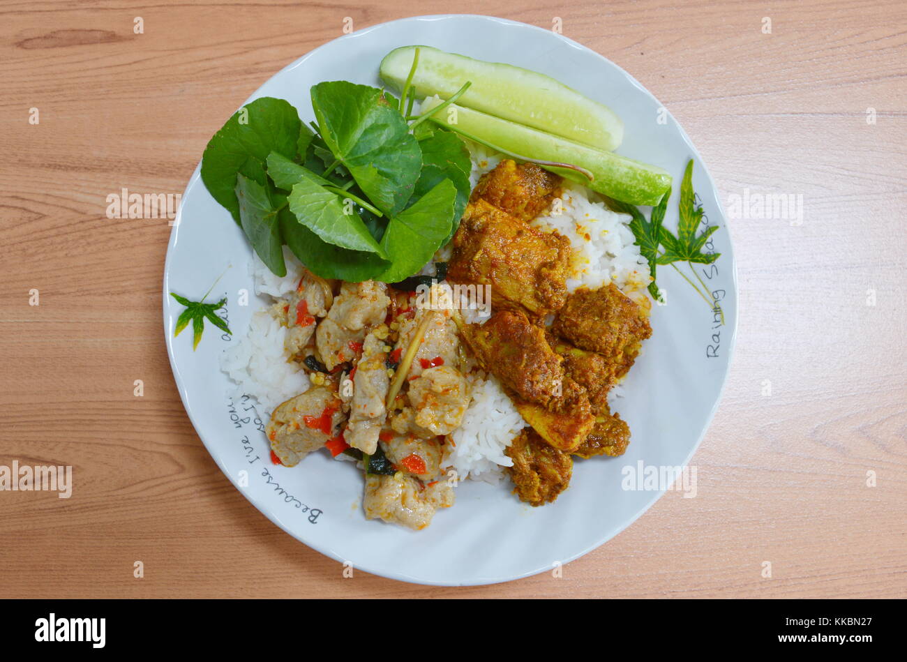 spicy pork bone and fish ball in curry on rice Stock Photo Alamy