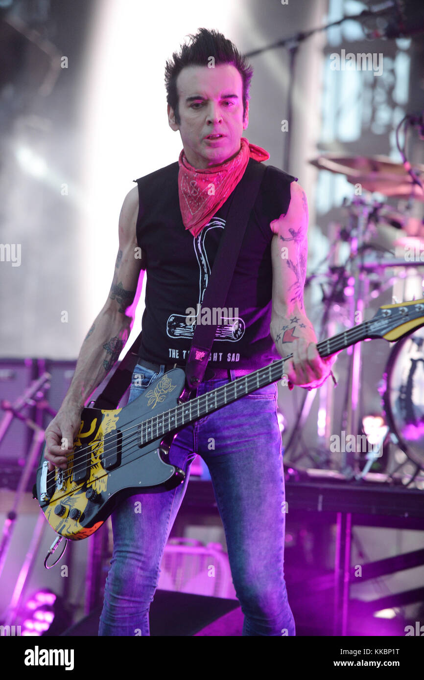 MIAMI FL - JUNE 26: Simon Gallup of The Cure performs at Bayfront Park ...