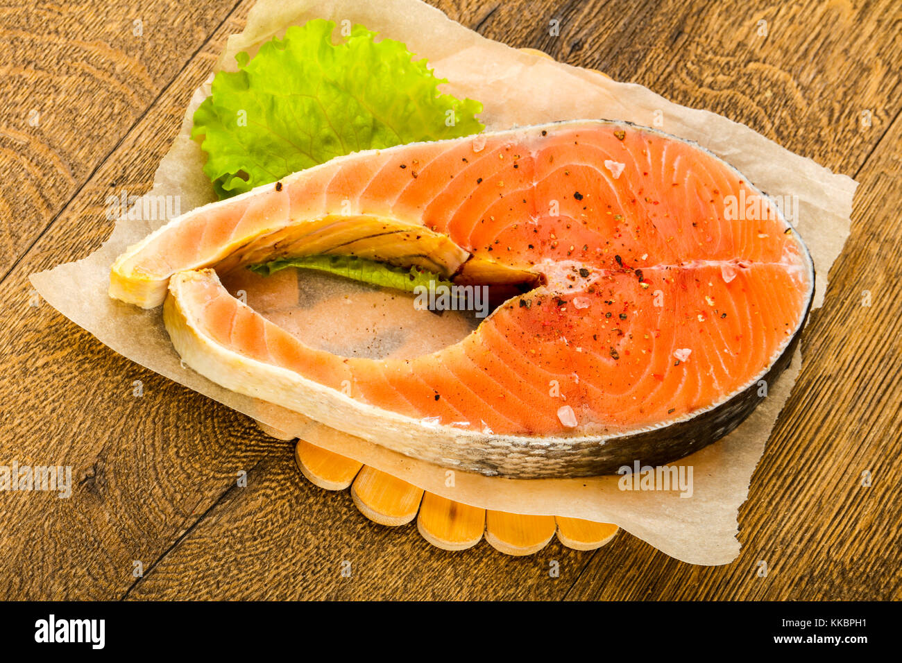 Raw salmon with salt and pepper ready for cooking Stock Photo - Alamy