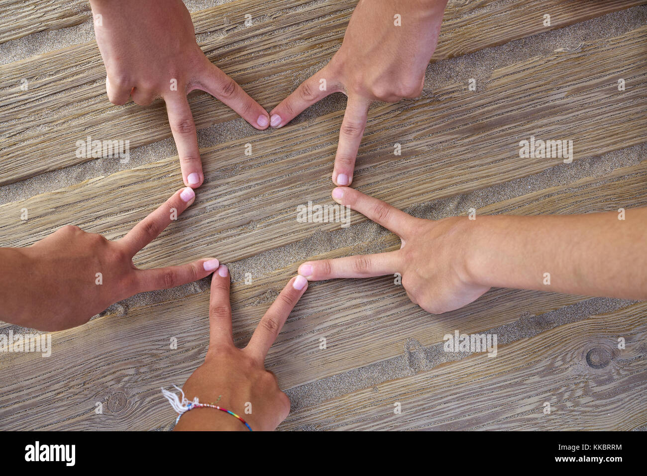 Friends touching fingers their hands hi-res stock photography and images -  Alamy