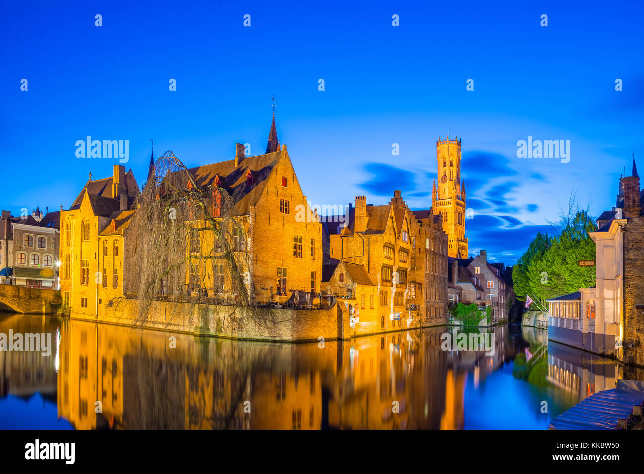 Bruges, Belgium - April 17, 2017: Night shot of historic medieval buildings along a canal in Bruges, Belgium Stock Photo