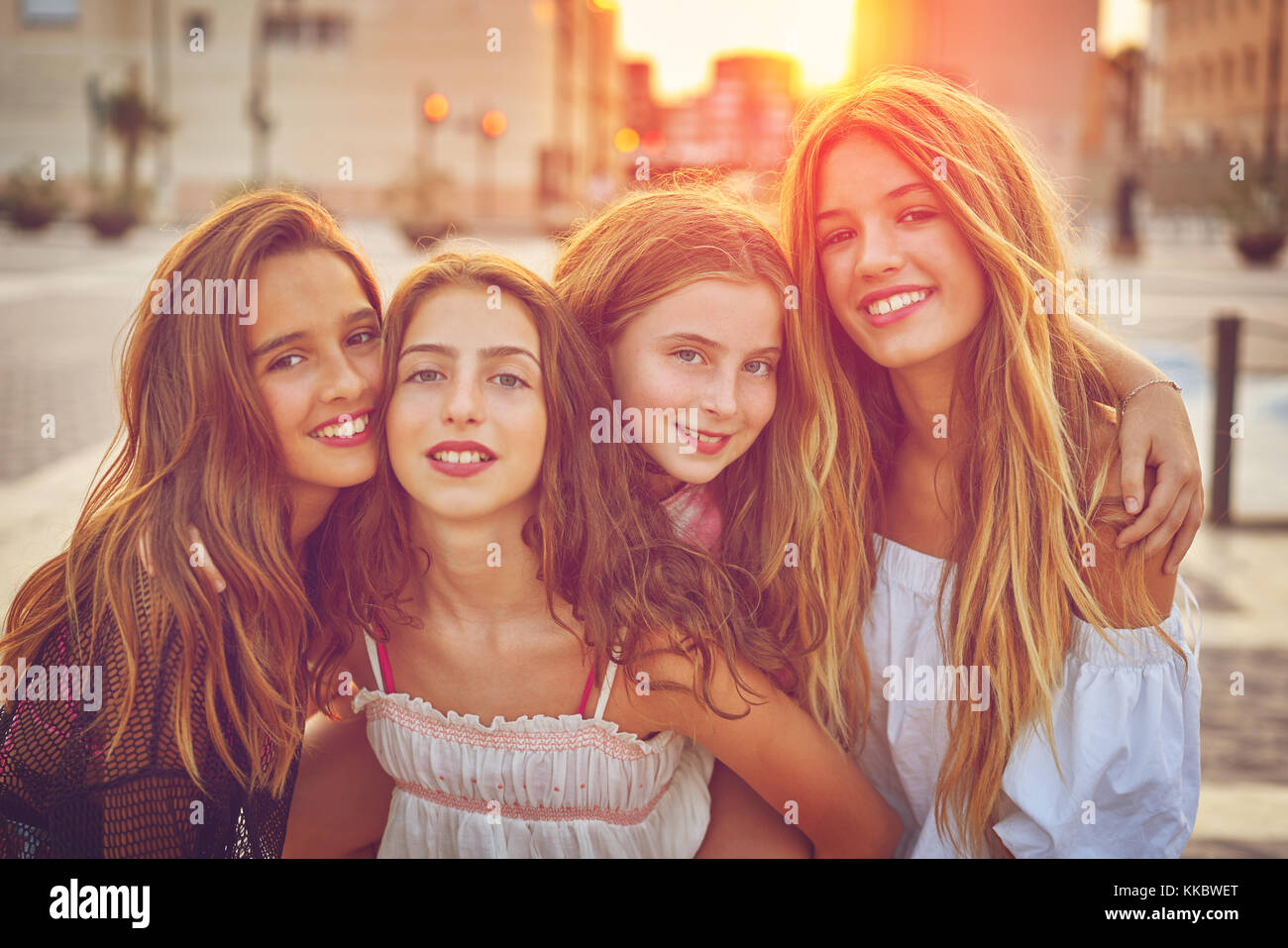 Best friends teen girls at sunset in the city filtered image Stock Photo