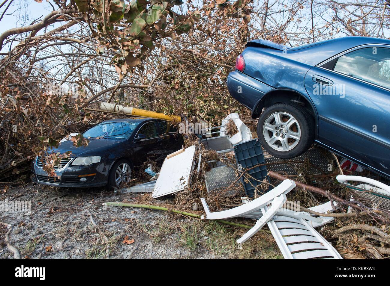 Debris and damaged cars behind the Big Pine Key Center in the