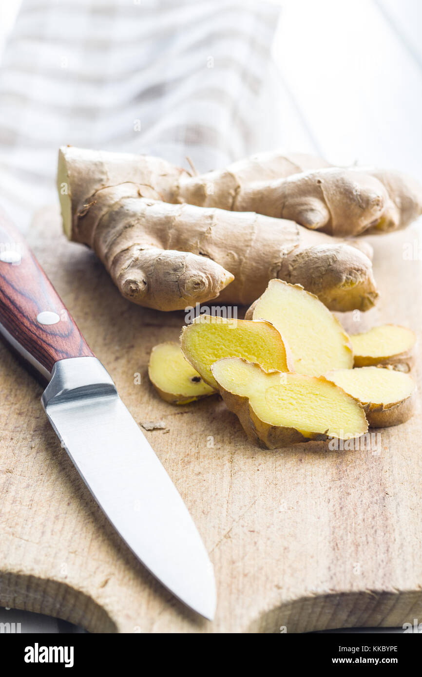 Sliced ginger root on cutting board Stock Photo Alamy