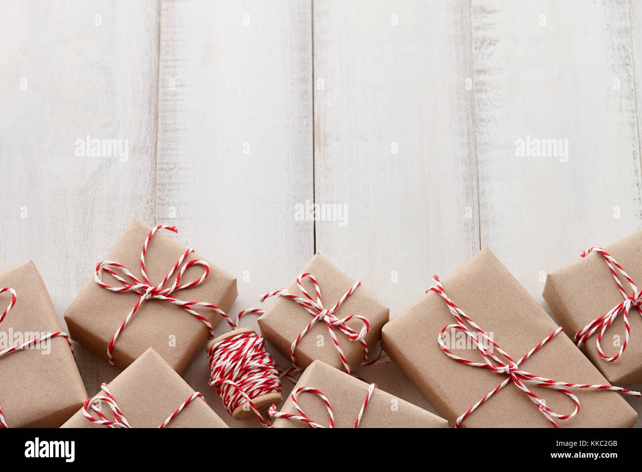 Christmas gift or present boxes wrapped in kraft paper Stock Photo - Alamy