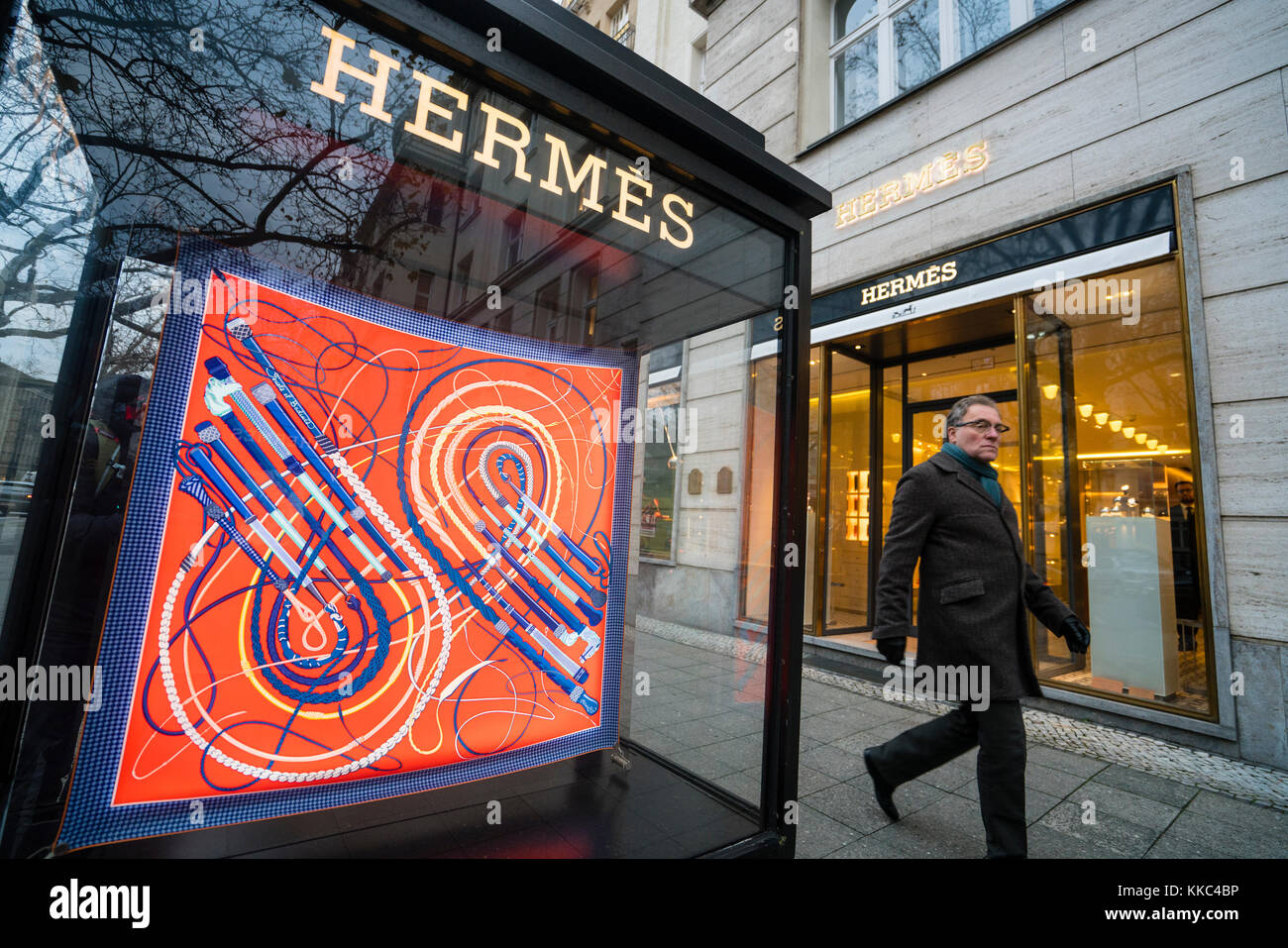 Glass display cabinet for luxury boutique Hermes on famous shopping street Kurfurstendamm , Kudamm, in Berlin, Germany. Stock Photo