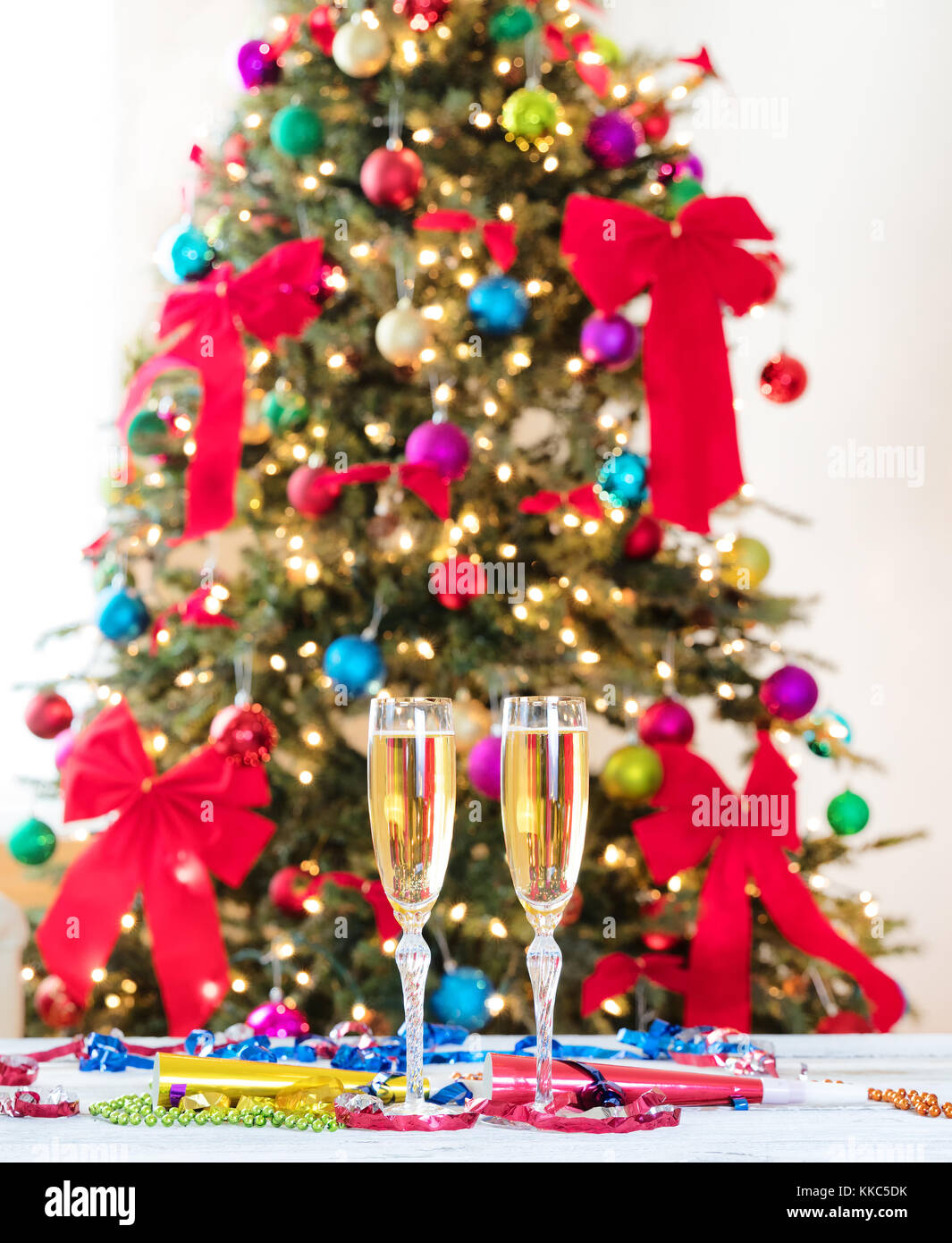 New Year party objects with Christmas tree in background Stock Photo