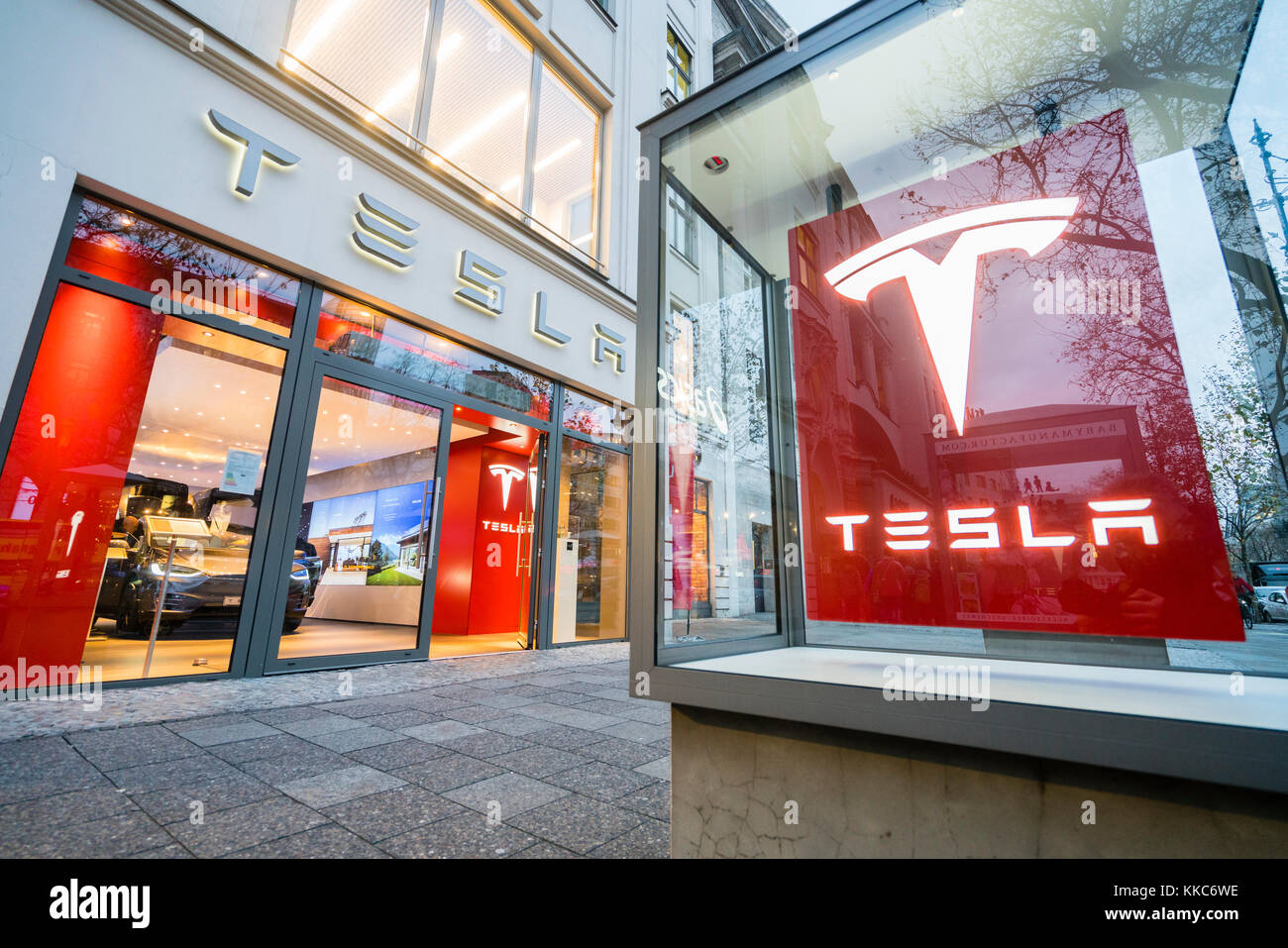 Glass display cabinet for Tesla car showroom on famous shopping street Kurfurstendamm , Kudamm, in Berlin, Germany. Stock Photo