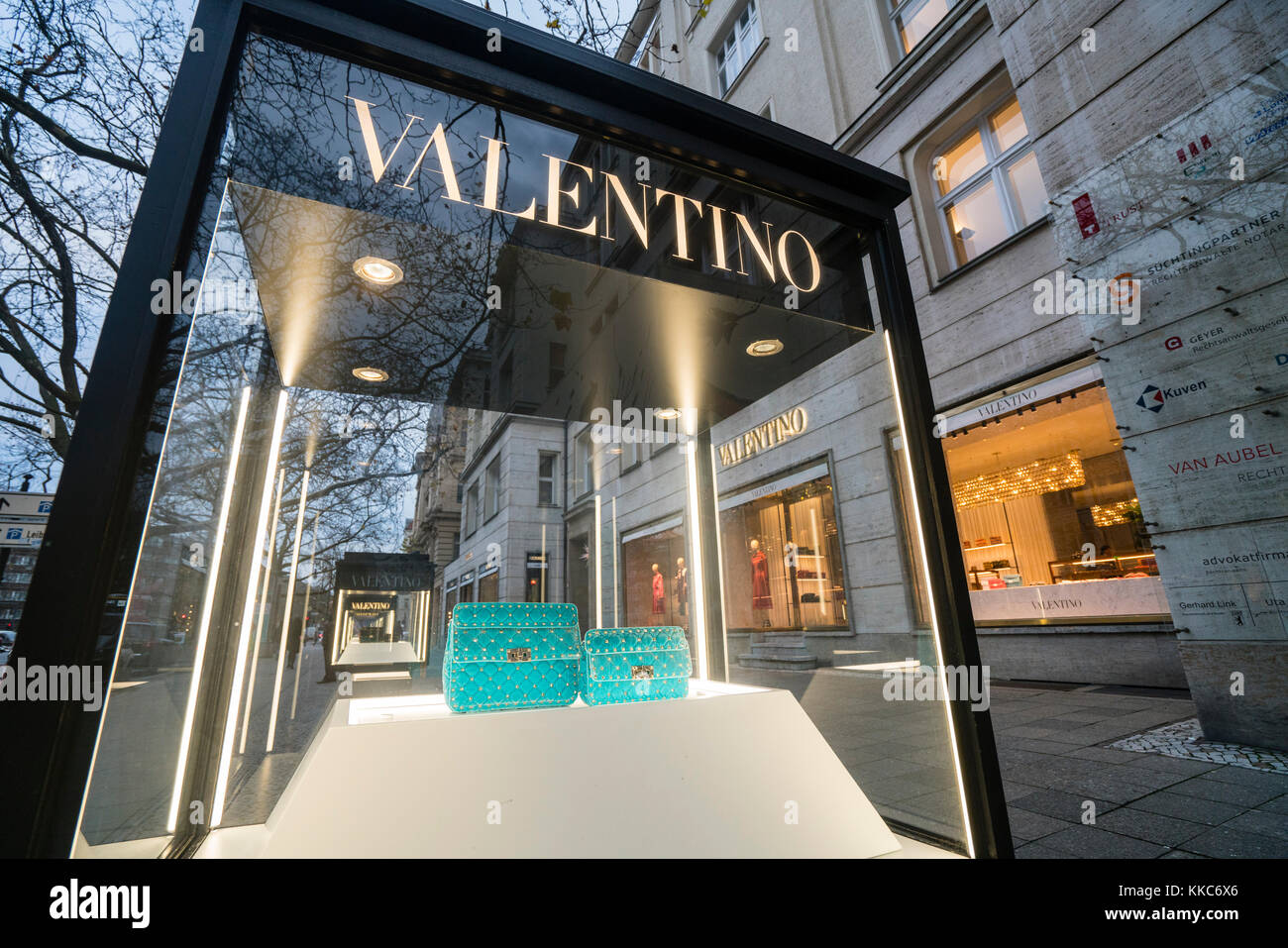 Glass display cabinet showing handbags for luxury boutique Valentino on famous shopping street Kurfurstendamm , Kudamm, in Berlin, Germany. Stock Photo
