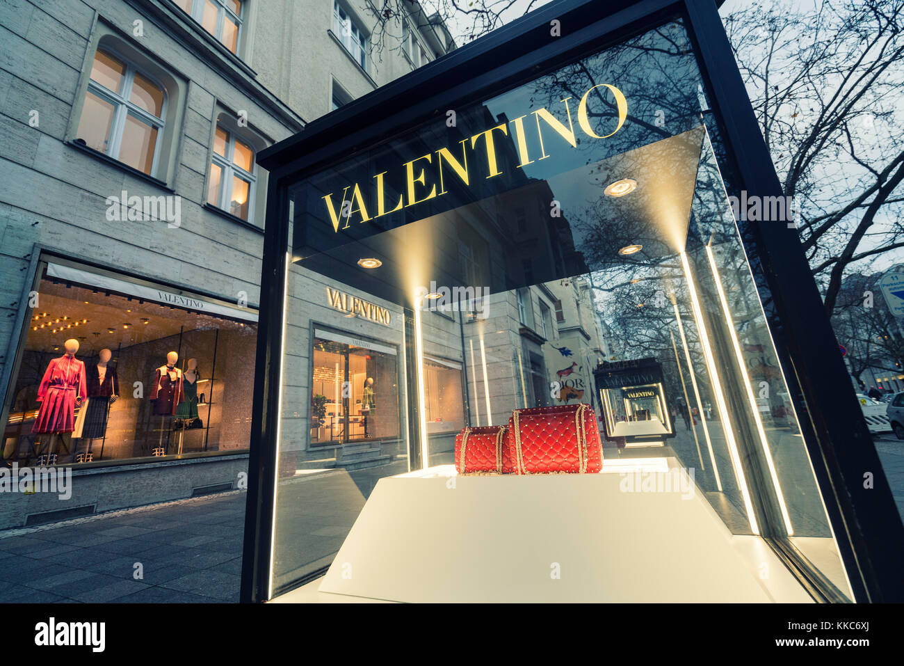 Glass display cabinet showing handbags for luxury boutique Valentino on famous shopping street Kurfurstendamm , Kudamm, in Berlin, Germany. Stock Photo