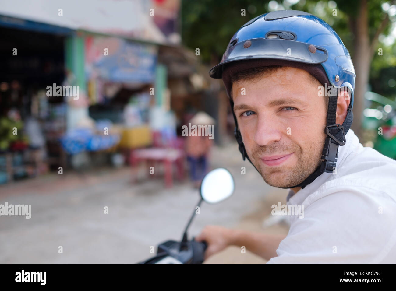 Young man with motorcycle helmet hi-res stock photography and images ...