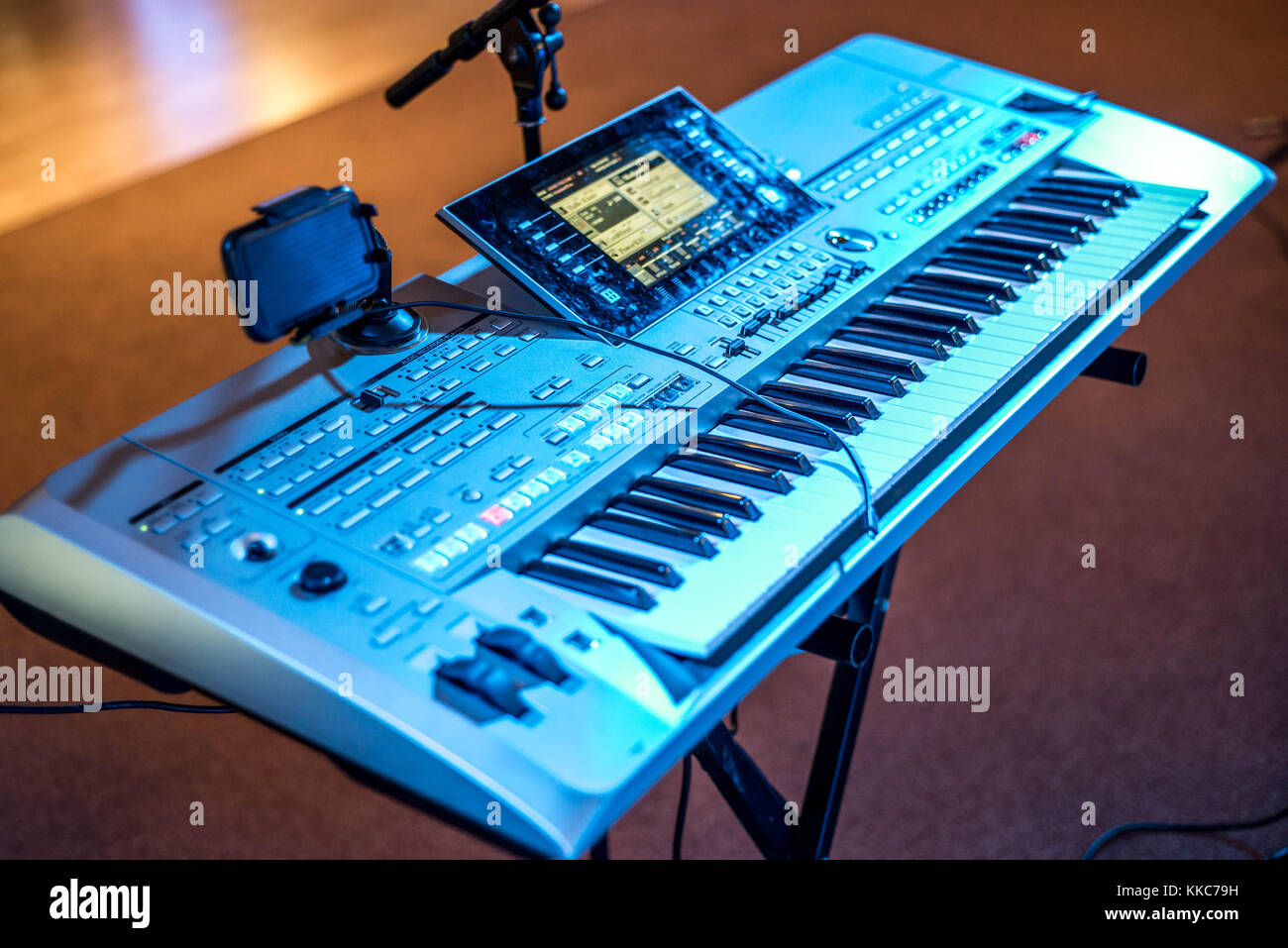 Classical electronical music keyboard view in blue concert lights bokeh