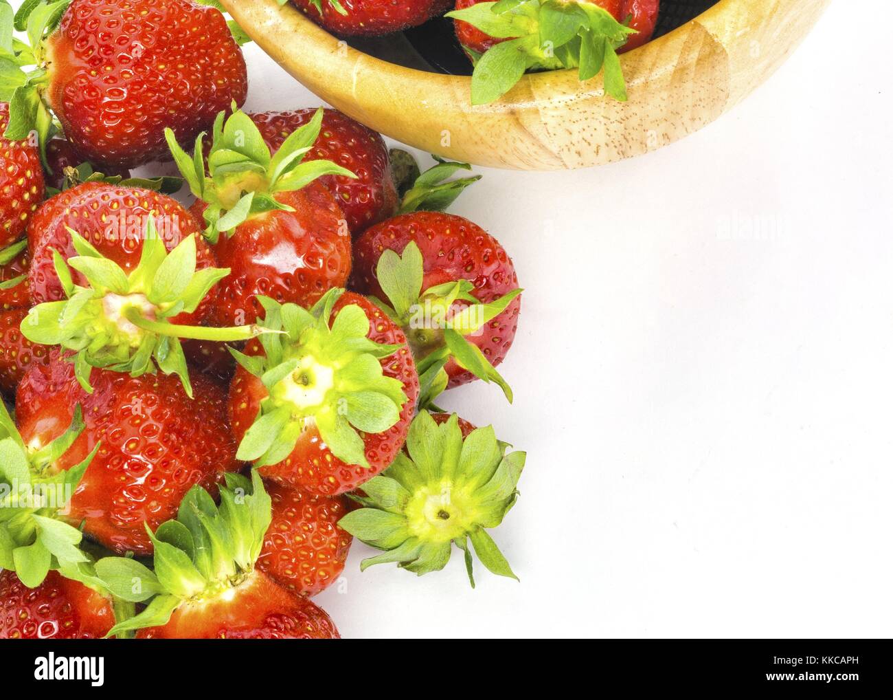 fresh whole strawberries in wooden bowl Stock Photo - Alamy
