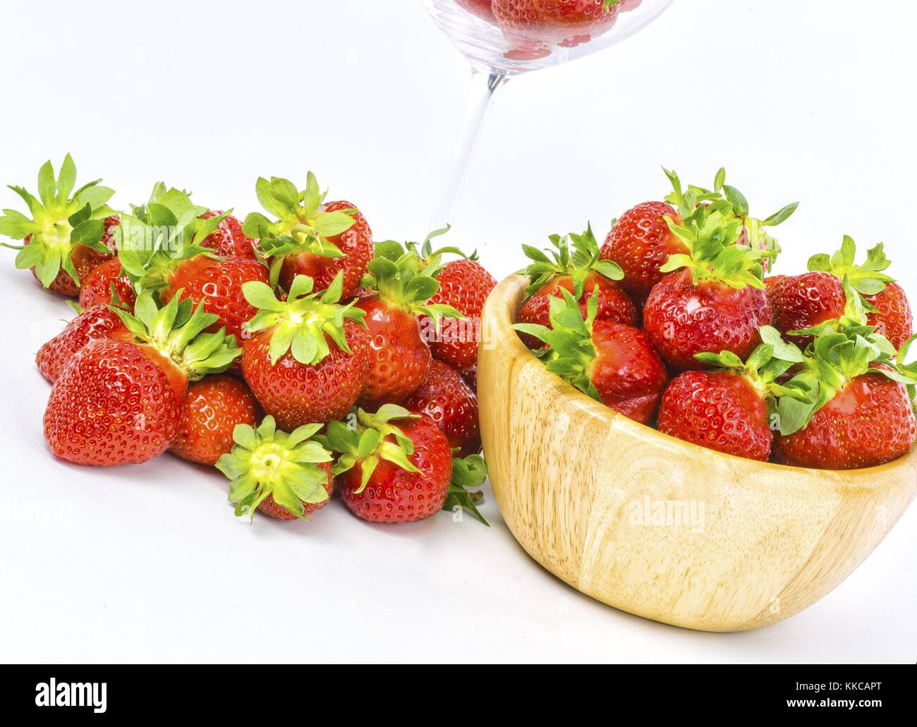 fresh whole strawberries in wooden bowl Stock Photo - Alamy