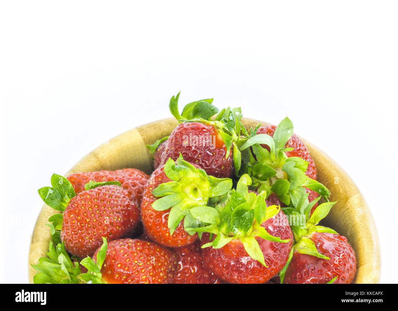 fresh whole strawberries in wooden bowl Stock Photo - Alamy