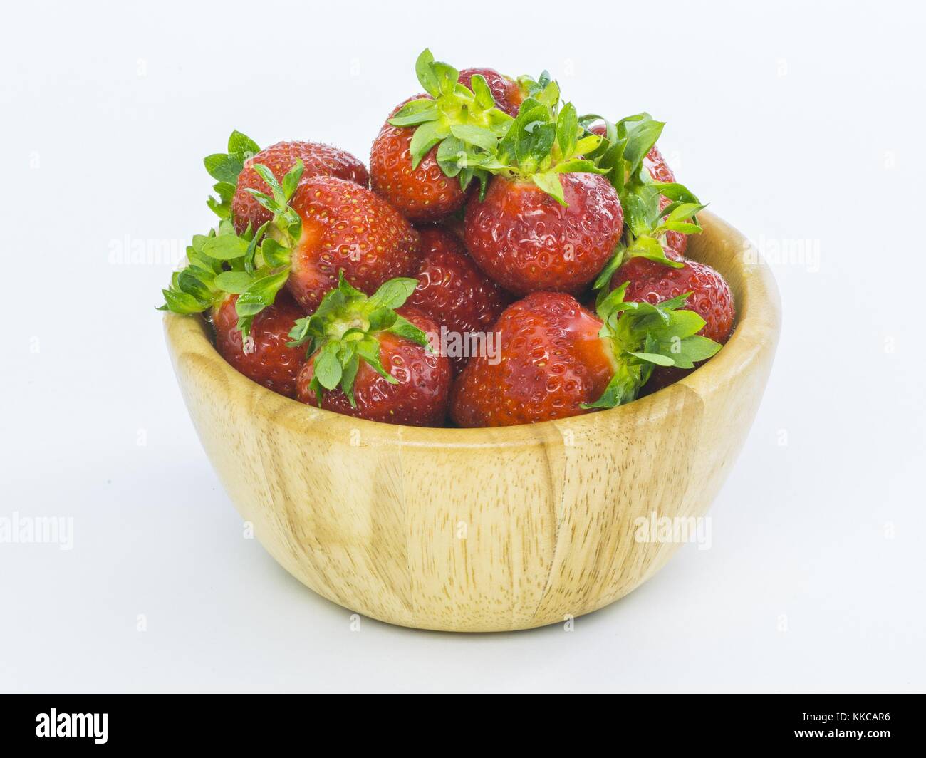 fresh whole strawberries in wooden bowl Stock Photo - Alamy