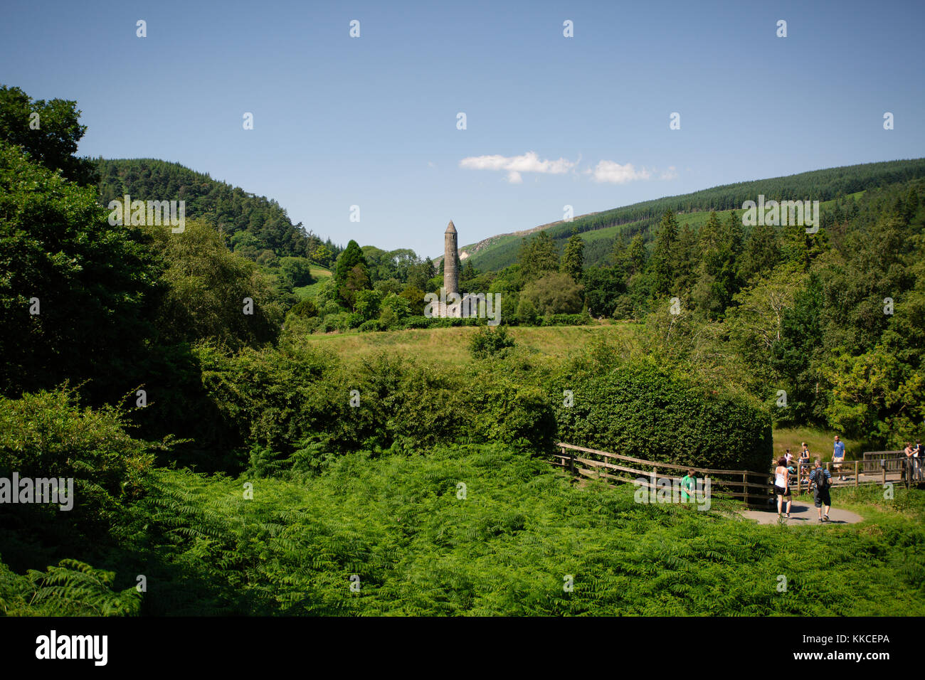 Tourists visiting beautiful Glendalough Lower Valley with view on a