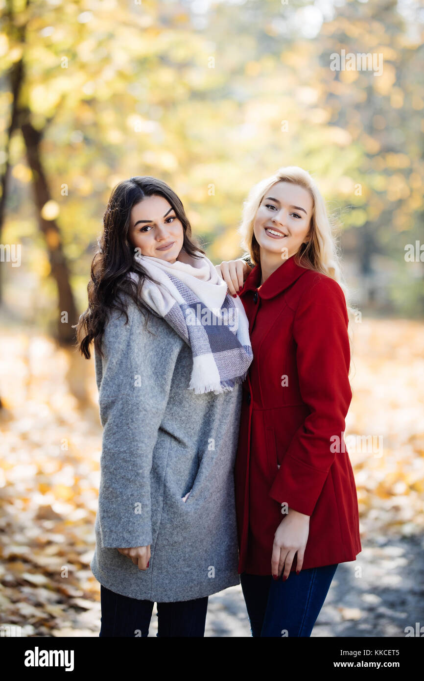 outdoor portrait of two young women in autumnal park Stock Photo - Alamy