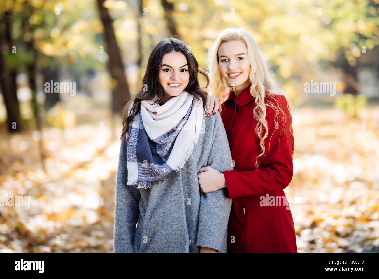 outdoor portrait of two young women in autumnal park Stock Photo - Alamy