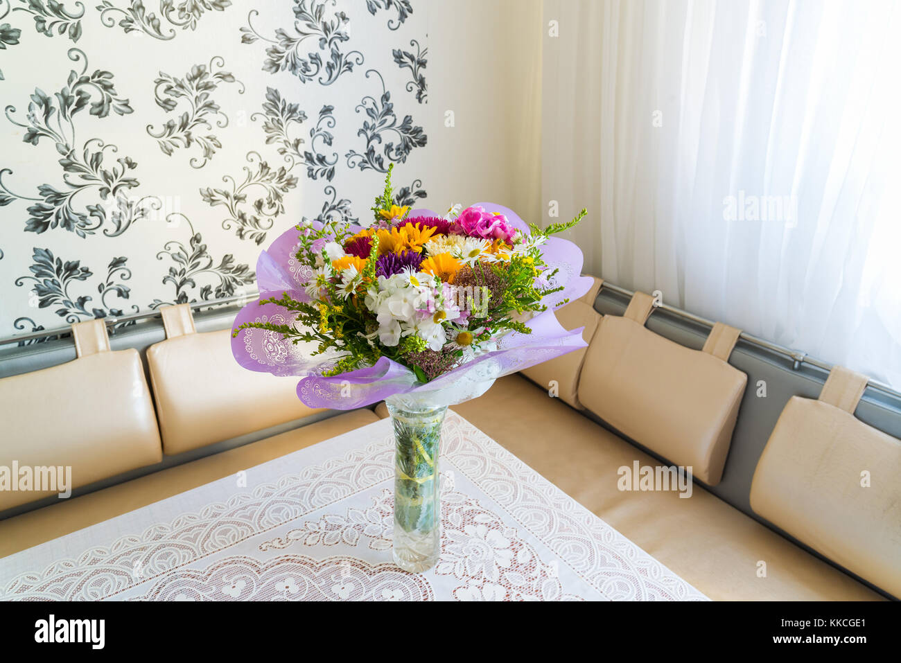 Bouquet of flowers on table in the room Stock Photo Alamy