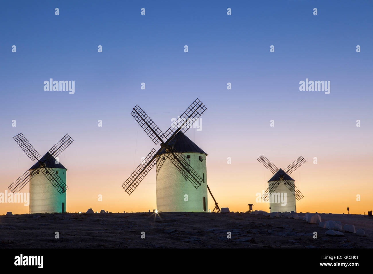 Illuminaed traditional windmills at rising, Campo de Criptana, Spain Stock Photo