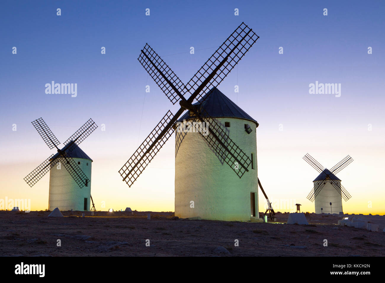 Illuminated traditional windmills at rising, Campo de Criptana, Spain Stock Photo