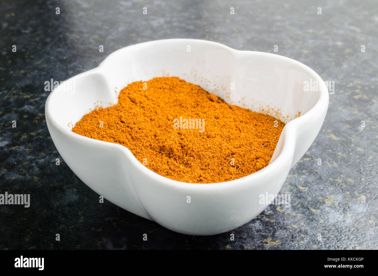 Ground Paprika Powder in a White Bowl Stock Photo