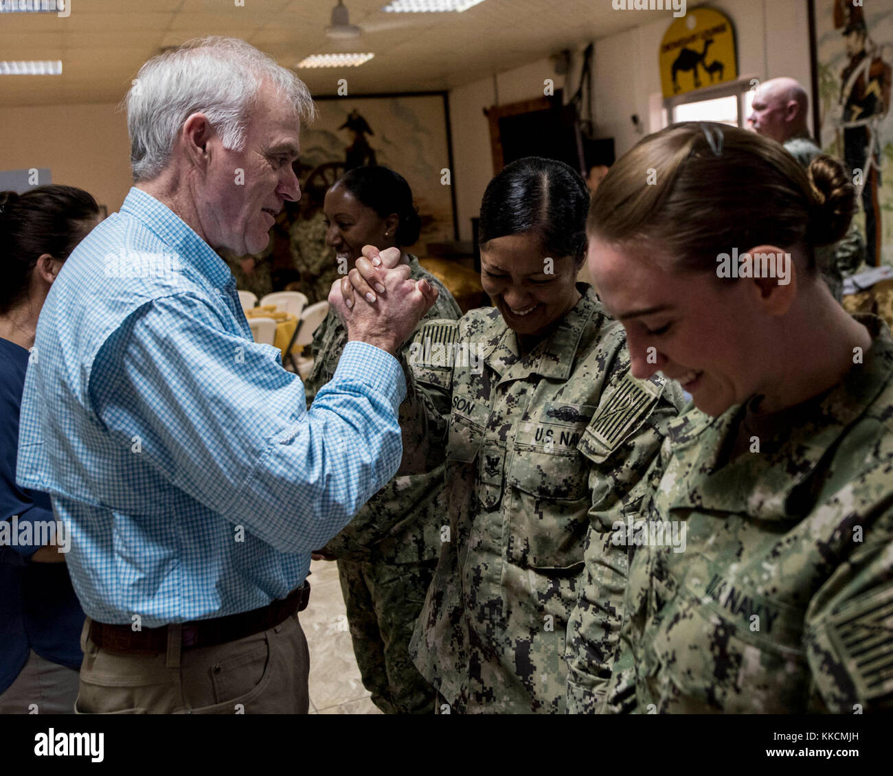 The Secretary of the Navy Richard V. Spencer and his wife, Mrs. Sarah Pauline Finch Spencer, had breakfast with troops and toured Camp Lemonnier’s facilities during a visit to the base, Nov. 24, 2017. While on base, Mrs. Spencer toured the enlisted barracks, Emergency Medical Facility Fitness Center, Navy Exchange and galley. (U.S. Air National Guard photo by Staff Sgt. Allyson L. Manners) Stock Photo